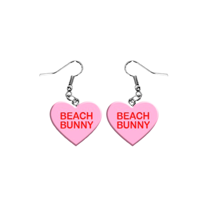 a pair of pink heart shaped earrings