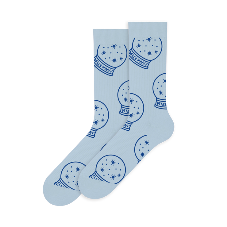 a pair of socks with snow globes on them